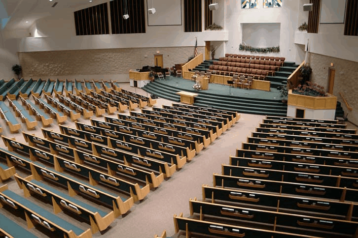 Renovated Lutheran church sanctuary with Kivett's pews