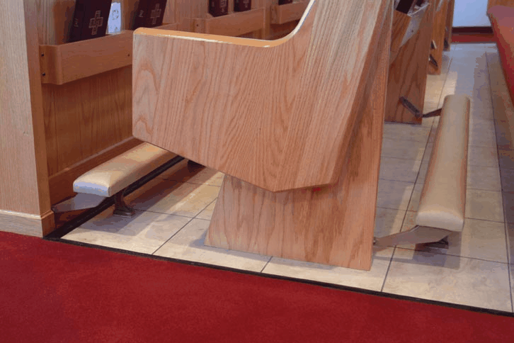 metal kneeler on church pew